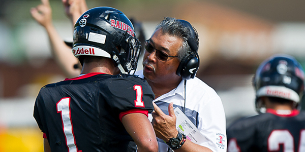 image of coach talking to players